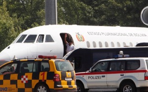 Bolivian President Morales waves from his plane before leaving the Vienna International Airport in Schwechat